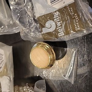 Cabinet knobs,20,New in packages,Blonde wood,goldtone metal.Stunning!